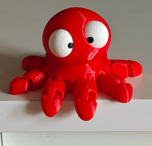 Mini Flexi Octopus figura de colección con ojos móviles y diseño flexible.